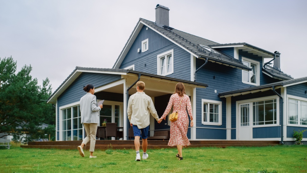 Young Couple Viewing Property for Sale